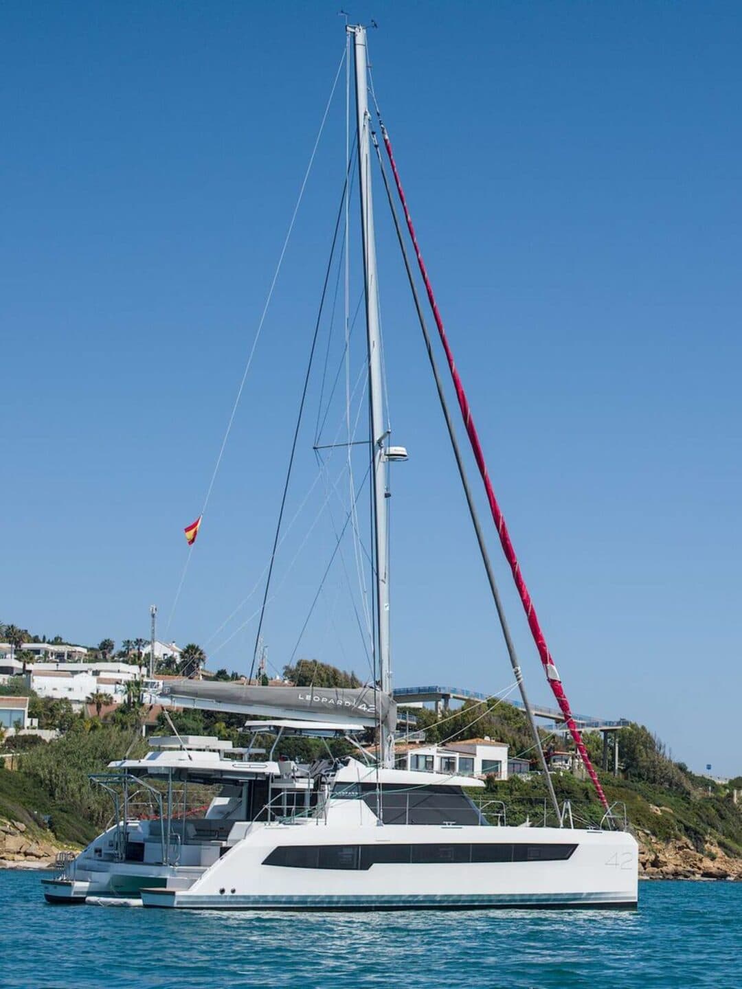 KOSMOS catamaran anchored in turquoise water