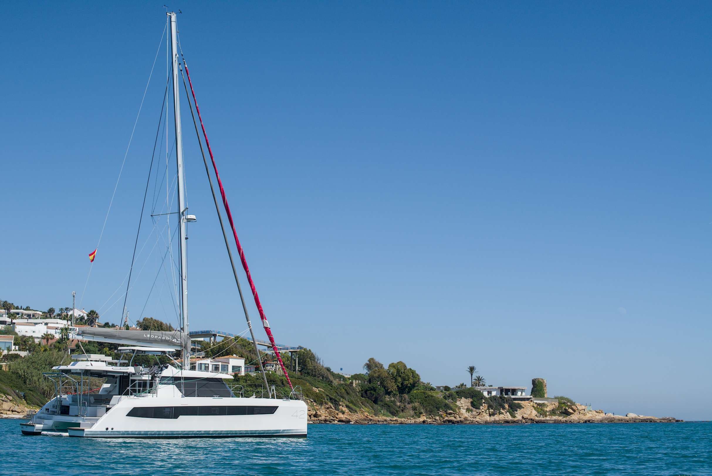 KOSMOS catamaran anchored in turquoise water