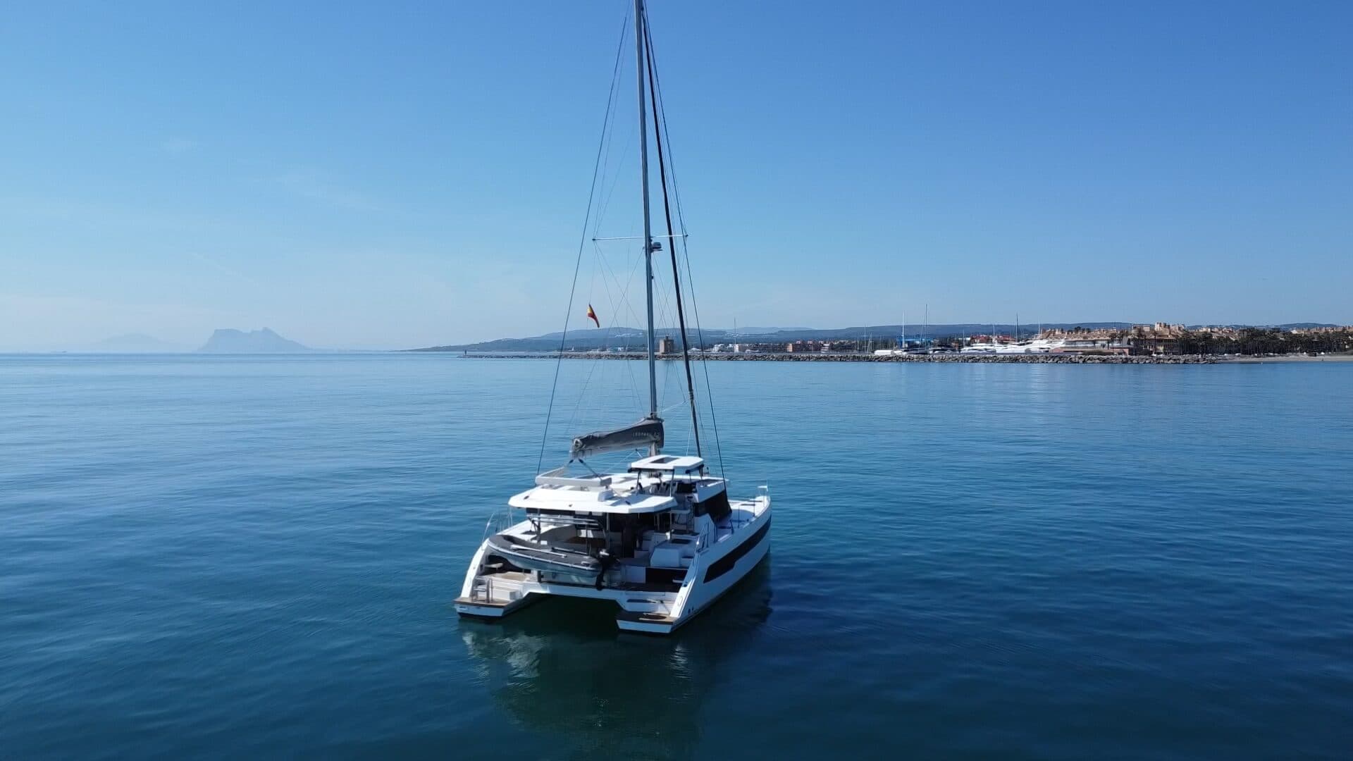 KOSMOS catamaran from above with Rock of Gibraltar in the background